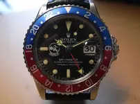 gmt+tomcat+felix+logo+on+rolex.webp