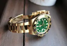 Rolex-GMT-Master-II1-rolex-gold-watch-green-dial-1024x699.webp