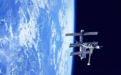 space_station_mir_over_earth.webp