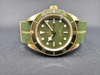 Tudor-Black-Bay-Fifty-Eight-Yellow-Gold-Green-Dial-M79018V-0001-Front_1280x1280.webp