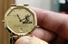 a-shopkeeper-displays-a-watch-bearing-a-portrait-of-late-iraqi-president-saddam-hussein-at-hi...webp