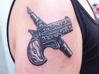 gun_and_pen_by_tabry-d30y550.webp