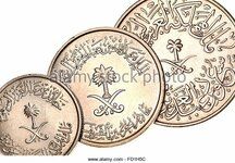 coins-of-saudi-arabia-showing-eastern-arabic-writing-and-numerals-fd1h5c.jpg