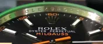 rolex-milgauss-green-crystal-black-dial.webp