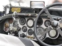 depositphotos_83711624-stock-photo-dashboard-and-steering-wheel-in.webp