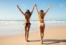81050646-beautiful-girls-in-bikin-walking-on-the-beach.webp