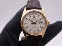 rolex day date 1803 gold 5060.webp